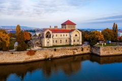 Castle of Tata city in Hungary. Amazing water fort next to Old lake. Built in 13th century. Beautiful dramatic sunrise view.