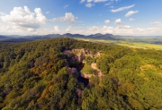 Flooded ancient stone quarry in Hungary near Sarospatak. Megyer-hegyi tengerszem. Small lake at the top of a hill. View from the top. Fantastic nature attraction in Tokaj area.