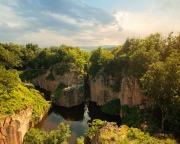Flooded ancient stone quarry in Hungary near Sarospatak. Megyer-hegyi tengerszem. Small lake at the top of a hill. View from the top. Fantastic nature attraction in Tokaj area.
