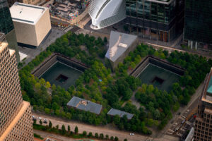 Aerial view about the 9/11 memorial place and museum in Newy York city, Lower Manhattan. Next to the One world trade center building.